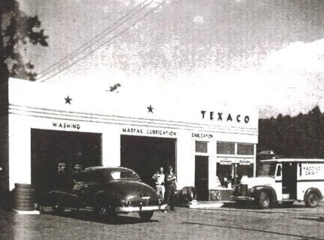 Black and white photo of the former Texaco gas station at 977 National Highway