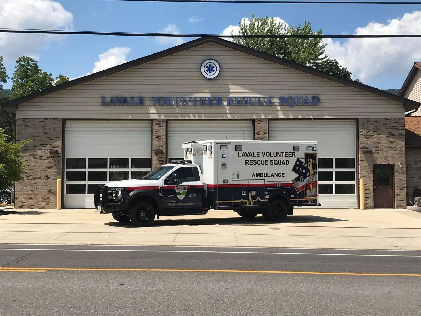 LaVale Volunteer Rescue Squad ambulance 374 parked in front of the station's bay doors